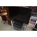 A Toshiba 42' TV , stand etc