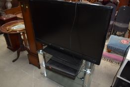 A Toshiba 42' TV , stand etc