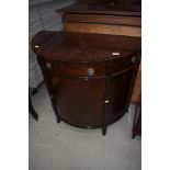 A reproduction Regency style mahogany demi lune cabinet, width approx. 88cm