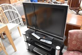 A Sony TV, Stand and other accesories