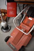 A Flymo Chevron 350S electric lawnmower and a Alko garden shredder