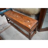 A solid oak narrow box stool, width approx. 108cm