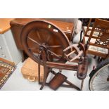 A traditional spinning wheel and accesories