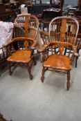 A near pair of venacular country Windsor armchairs, solid seats, hoop and stick back, scroll arms, H