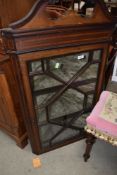 An Edwardian mahogany and inlaid corner display wall cabinet havinbg astral glazed doors and lined