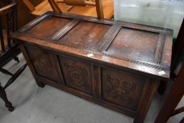 A traditional carved oak three panel bedding box of lovely small proportions, approx. 92 x 41 x