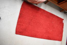 A vintage wool fireside rug, approx 140 x 70cm