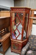 A modern Oriental style display cabinet with lower cupboard section, height approx. 180cm