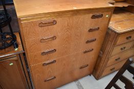 A 1970s style teak bedroom chest of five graduated drawers, labelled inside drawer William