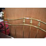 A reproduction brass double headboard
