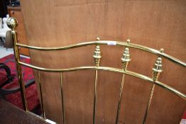 A reproduction brass double headboard