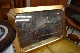 A reproduction gilt frame wall mirror in the Art Deco style