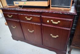 A reproduction low sideboard , looks nice quality, labelled for J E Coyle, width approx. 126cm