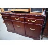 A reproduction low sideboard , looks nice quality, labelled for J E Coyle, width approx. 126cm