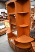 A selection of mid century style teak effect wall units by Nathan including two corner units and one