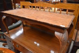 An early to mid 20th Century walnut coffee table having cabriole legs, approx. 107 x 46cm