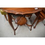 An early 20th Century mahogany occasional table having shaped top