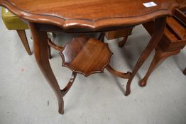 An early 20th Century mahogany occasional table having shaped top