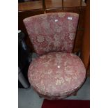 A vintage low seat nursing chair