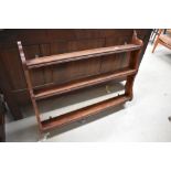 A stained pine plate rack, width approx. 99cm