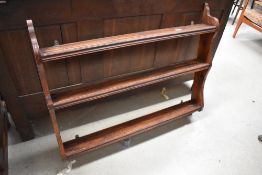 A stained pine plate rack, width approx. 99cm