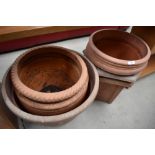 A collection of plastic terracotta effect garden planters