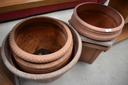 A collection of plastic terracotta effect garden planters