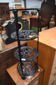 A cast iron pan stand, reproduction