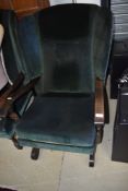 A vintage wood frame and green dralon wing back chair and similar rocker