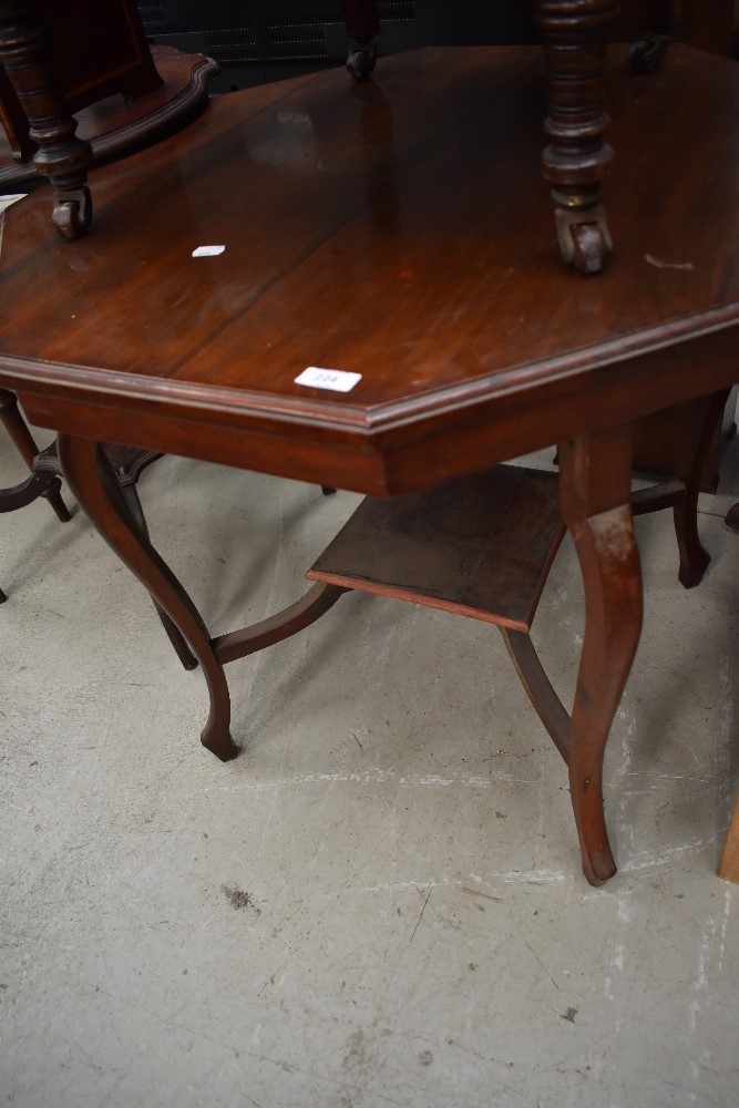A late 19th/early 20th Century mahogany octagonal occasional table having shaped legs and square