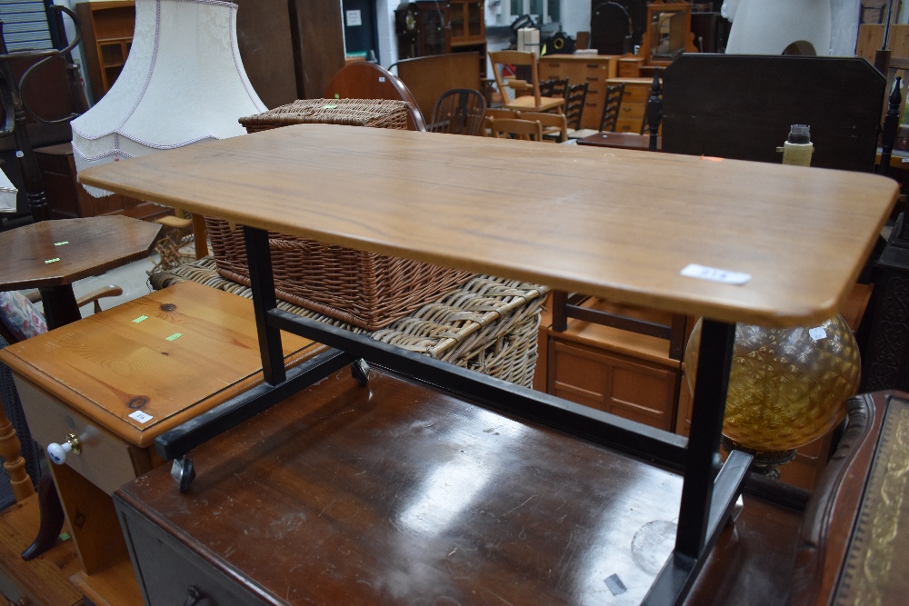 A vintage formica top coffee table/trolley having metal frame, approx width 76cm