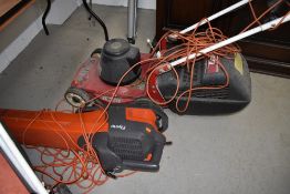 An Emblem electric lawnmower and Flymo garden vac