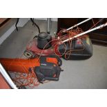 An Emblem electric lawnmower and Flymo garden vac