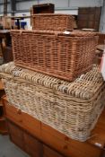 A selection of wicker woven baskets and hampers including large coffee table size