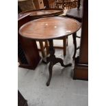 A Victorian mahogany occasional table having circular top, turned column and triple splay legs,