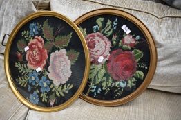 Two vintage woolwork panels in circular frames