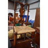 A period oak and elm vase back chair having later strung seagrass style seat