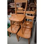 A set of five modern beech kitchen chairs in the traditional railback design
