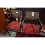 A pair of early 20th Century bergere armchairs