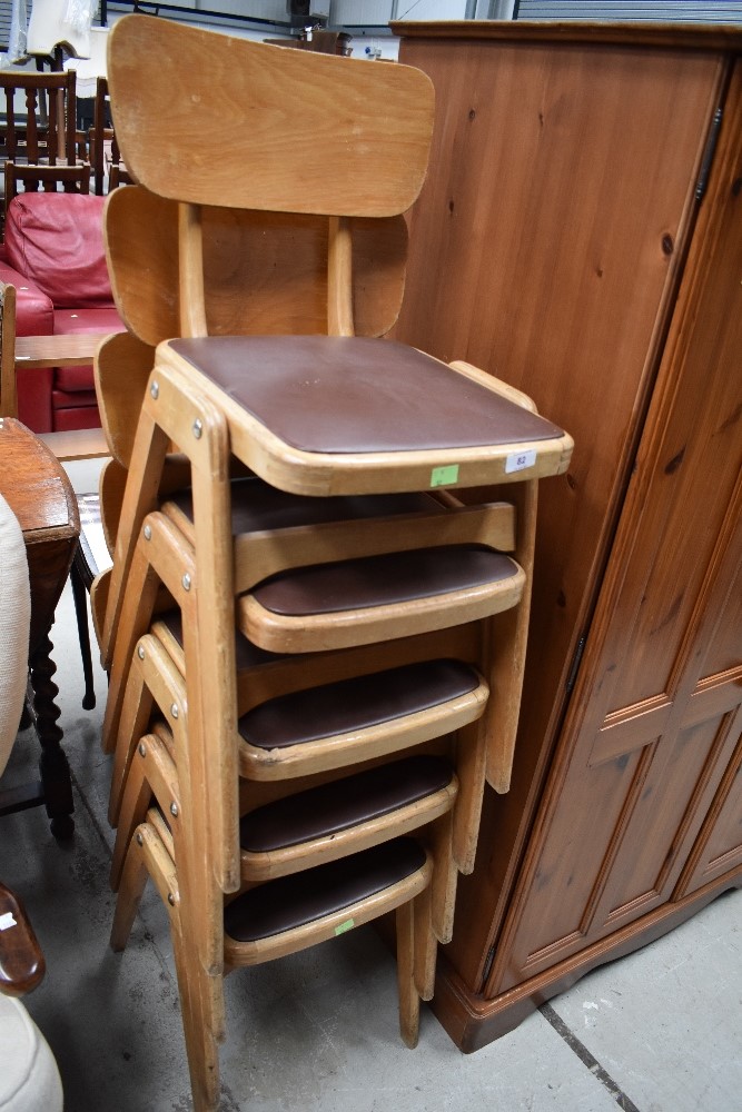 A set of five vintage (1950s/1960s) bentwood and ply stacking chairs having brown vinyl seats,