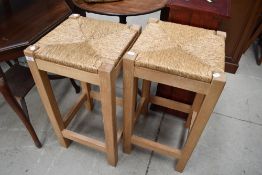 A pair of modern rush seated stools