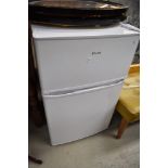 A Lowry fridge freezer of small proportions, height approx. 84cm, used but clean, bottom plastic
