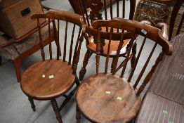 A pair of late 19th Century spindle back chairs having solid seats, turned frame and H stretchers