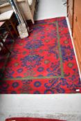 A vintage carpet square, approx. 188 x 140cm