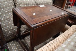 A Priory style oak drop leaf occasional table