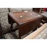 A Priory style oak drop leaf occasional table