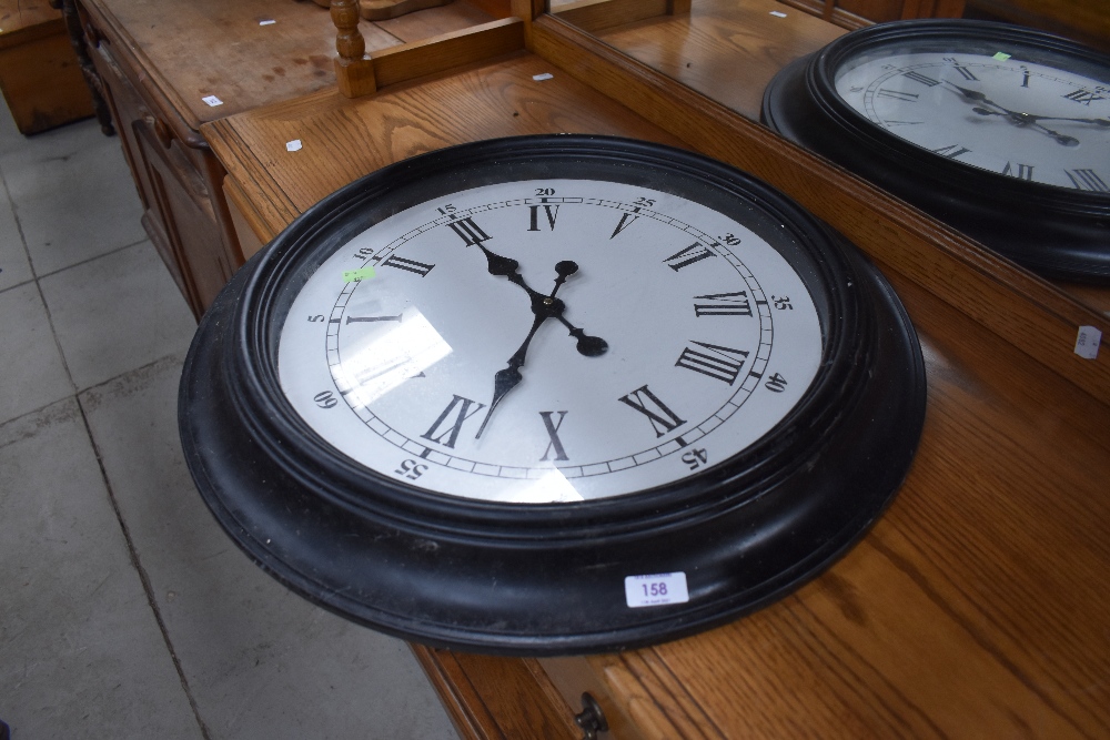 A modern oversized wall clock having battery movement, diameter approx. 60cm