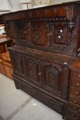 A Period oak court cupboard , extensively carved, bears carved initials DI and date of 1729 (
