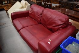 A modern settee , very clean oxblood leather, width approx. 220cm, depth approx. 110cm