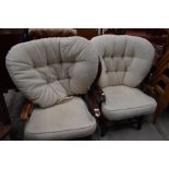 A pair of traditional stained frame upholstered cottage style armchairs